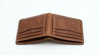 Open brown leather wallet with multiple card slots and stitched details, isolated on white background for design and commercial use.
