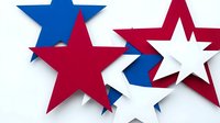 Patriotic star shapes in red white and blue colors arranged in overlapping composition for holiday celebrations and national events.