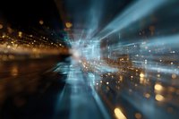 Abstract motion blur with glowing blue light rays and golden bokeh particles creating dynamic perspective tunnel effect for technology backgrounds.