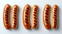Grilled sausages with appetizing char marks arranged in neat rows on white background, showcasing juicy meat and golden-brown casing for food marketing.
