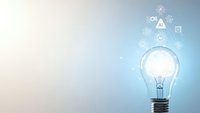 Light bulb with glowing innovation icons on gradient background representing creative ideas, technology solutions and business inspiration concepts.