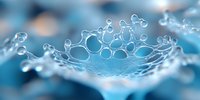Delicate water crown splash frozen in time against blue background, showing intricate details of liquid droplets forming circular patterns in macro photography.
