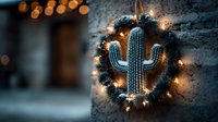 Festive cactus wreath with warm LED lights hanging on textured wall creates cozy holiday atmosphere for southwestern Christmas decor and seasonal celebrations.