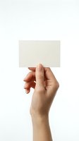Female hand holding blank white business card mockup against neutral background for branding and corporate identity design projects.