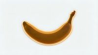Golden banana isolated on white background, ready for design projects, packaging, and marketing materials.