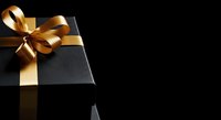 Luxury black gift box with golden ribbon bow on dark background, perfect for holiday and celebration designs.