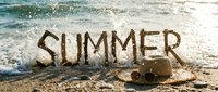 Summer text written in sand on sunny beach with straw hat and sunglasses, ocean waves splashing in background, vacation concept.