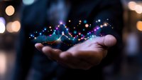Businessman holding glowing digital data analytics charts and graphs in palm. Financial technology concept for business intelligence and market analysis.