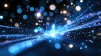 Glowing blue light rays with bokeh effect on dark background, abstract cosmic energy concept for technology and science backgrounds.