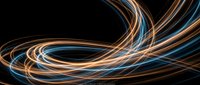 Dynamic flowing light trails in blue and orange creating elegant curved motion patterns against black background for modern digital design projects.