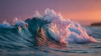 Ocean wave crashing with dramatic splash at sunset, golden hour lighting creates warm purple and orange tones across turbulent seascape for nature photography.