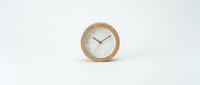 Wooden round clock with white face and minimalist design isolated on white background, suitable for home decor, interior design, and product mockups.