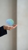 Business professional hand presenting holographic brain icon representing artificial intelligence and mental health innovation concepts.