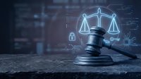 Legal gavel with glowing scales of justice symbol on digital background. Concept for law, compliance, and digital justice technology.
