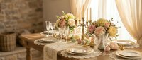 Elegant dining table setting with floral centerpieces, candles, and fine dinnerware in warm rustic interior for special occasions and celebrations.