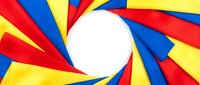 Colorful abstract geometric design with red, blue, and yellow rays radiating from white center circle, suitable for backgrounds and graphic design projects.