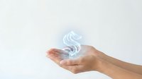 Hand holding glowing dollar sign symbol on white background, isolated for business, finance, money, investment, wealth, success, earnings, financial growth, banking, commerce, digital currency concepts.
