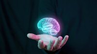 Glowing neon brain hologram floating above open palm against dark background. Artificial intelligence, neuroscience, mental health concept for technology presentations.