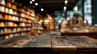 Empty rustic wooden table with blurred bookstore or library interior in background, creating atmosphere for product display or mockup.