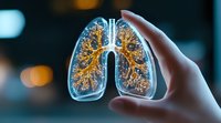 Glowing human lungs with golden bronchial tree structure held in hand against blurred bokeh background, medical anatomy visualization showing respiratory system.