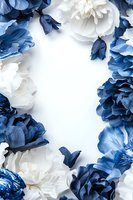 Elegant floral frame with white and classic blue peonies on light background creates romantic border composition for wedding stationery and celebrations.