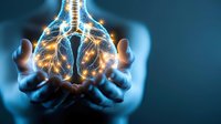 Glowing human lungs held in caring hands against dark background, medical concept visualization showing respiratory system health and healing energy.