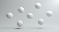 White golf balls floating on clean gray background with soft shadows for sports and recreation design projects.