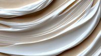 Elegant white silk fabric with soft flowing waves and gentle folds creates luxurious textile background in cream and ivory tones. Suitable for wedding designs.