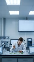 Male scientist in white lab coat examining plant samples with tweezers in modern research laboratory with computers and equipment for biotechnology studies.