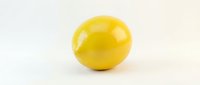 Single bright yellow egg yolk isolated on white background for culinary design and cooking concepts.