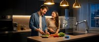 Young Caucasian couple cooking together in a smart kitchen with AI holographic display, sharing a joyful moment while preparing fresh vegetables.