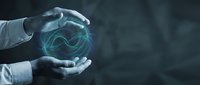 Businessman hands protecting glowing blue energy sphere with flowing light waves representing innovation, technology solutions and digital transformation.
