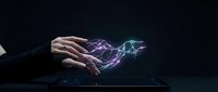 Business professional hands creating electric lightning energy above laptop computer showcasing digital power and technological innovation concept.