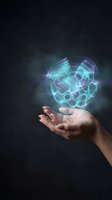 Human hand holding glowing holographic sphere with futuristic digital elements and light effects on dark background for technology concepts.