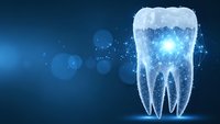 Digital tooth with glowing particles on blue background for dental care and oral health concepts in medical presentations and healthcare marketing materials.