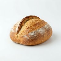 Freshly baked artisan sourdough loaf with crispy golden crust and flour dusting, isolated on white background for bakery, food, and culinary design use.