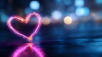 Glowing neon pink heart shape reflected on wet surface against blurred city lights background creates romantic Valentine's Day atmosphere.
