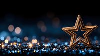 Golden star decoration on glittering blue background with bokeh lights creates magical holiday atmosphere, suitable for Christmas and festive designs.