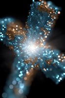 Abstract digital cross shape with glowing blue and gold particles emerging from center on dark background, creating ethereal light effect and bokeh pattern.