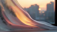 Ethereal smoke wisps create flowing curves against sunset cityscape backdrop, with warm orange and pink tones blending into cool gray swirls in atmospheric lighting.