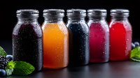 Fresh cold beverages in glass bottles with condensation drops, colorful natural drinks in purple, orange, blue, pink and red on dark background with mint leaves.