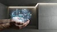Male hand holding glowing digital holographic interface with circuit board and data visualization elements for technology, innovation, and digital transformation concepts.