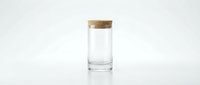 Clear glass jar with natural cork lid on white background for kitchen storage and pantry organization.