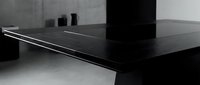 Modern black desk with sleek metal edge detail and minimalist design, isolated on white background, ready for interior design, furniture mockups, and contemporary workspace concepts.