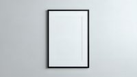 Empty black picture frame with white mat hanging on gray wall ready for artwork display and interior design mockup projects.