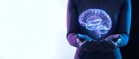 Businessman holding glowing digital brain hologram in cupped hands representing artificial intelligence, innovation and futuristic technology concepts.