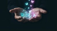 Hands holding glowing neon geometric shapes and butterflies against dark background. Concept for technology, innovation, creativity, and digital transformation in business and design.