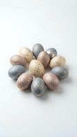Modern Easter eggs with geometric gold patterns arranged in circle on white background for spring holiday celebration and festive decoration.