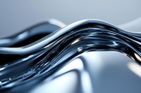 Smooth flowing liquid metal waves create dynamic abstract pattern in silver and blue tones, featuring glossy surface with light reflections and curved lines.