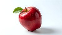 Fresh red apple with green leaf and water droplets isolated on white background for healthy eating and nutrition concepts.